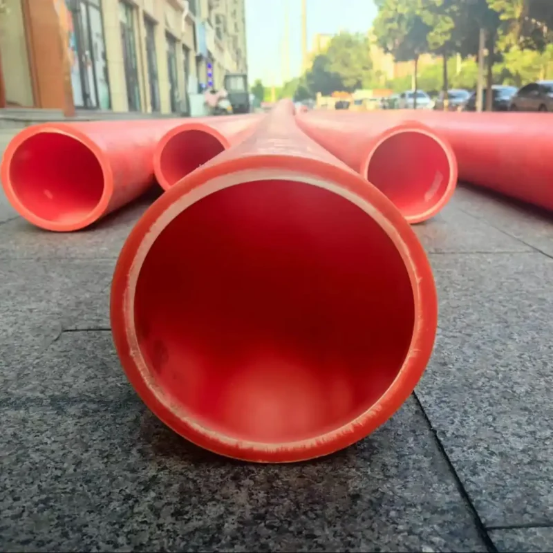 Underground trenchless installation of red MPP power pipes for cable protection