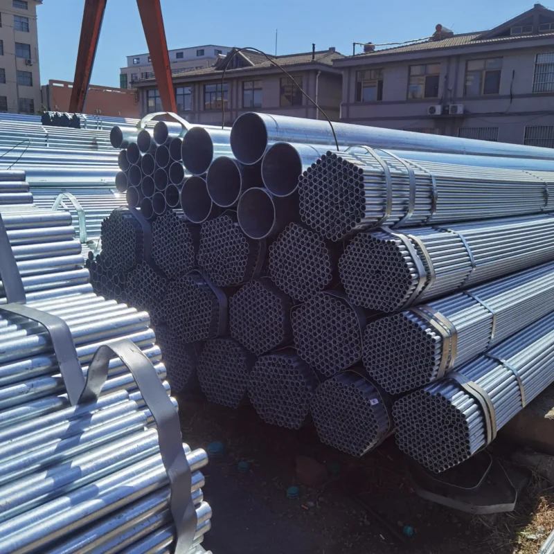 Large stock of bundled hot-dip galvanized steel pipes in warehouse